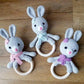 bunny ring rattles in various colours with embroidered eyes for baby's safety