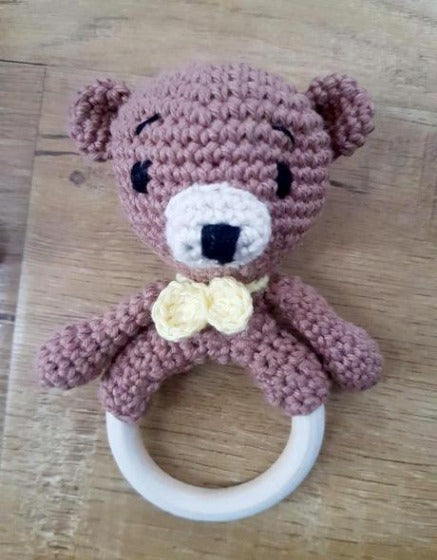 crocheted bear ring rattle with embroidered features for baby safety