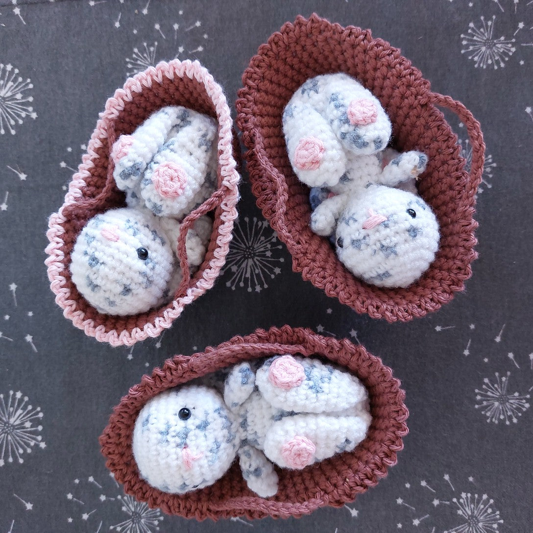 crocheted bunnies in baskets