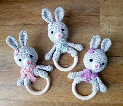 bunny ring rattles in various colours with embroidered eyes for baby's safety