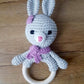 purple and grey bunny ring rattle with embroidered eyes for baby's safety