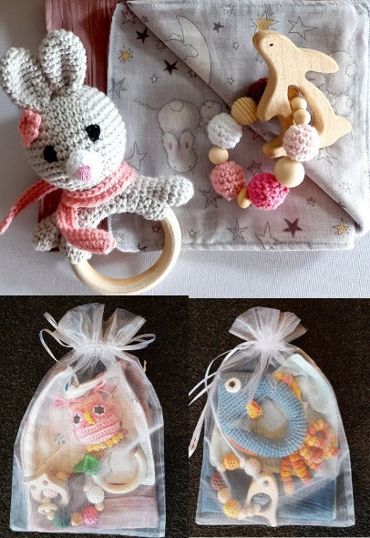 deluxe gift sets showing bunny with owl and fish sets packaged in gauze bags