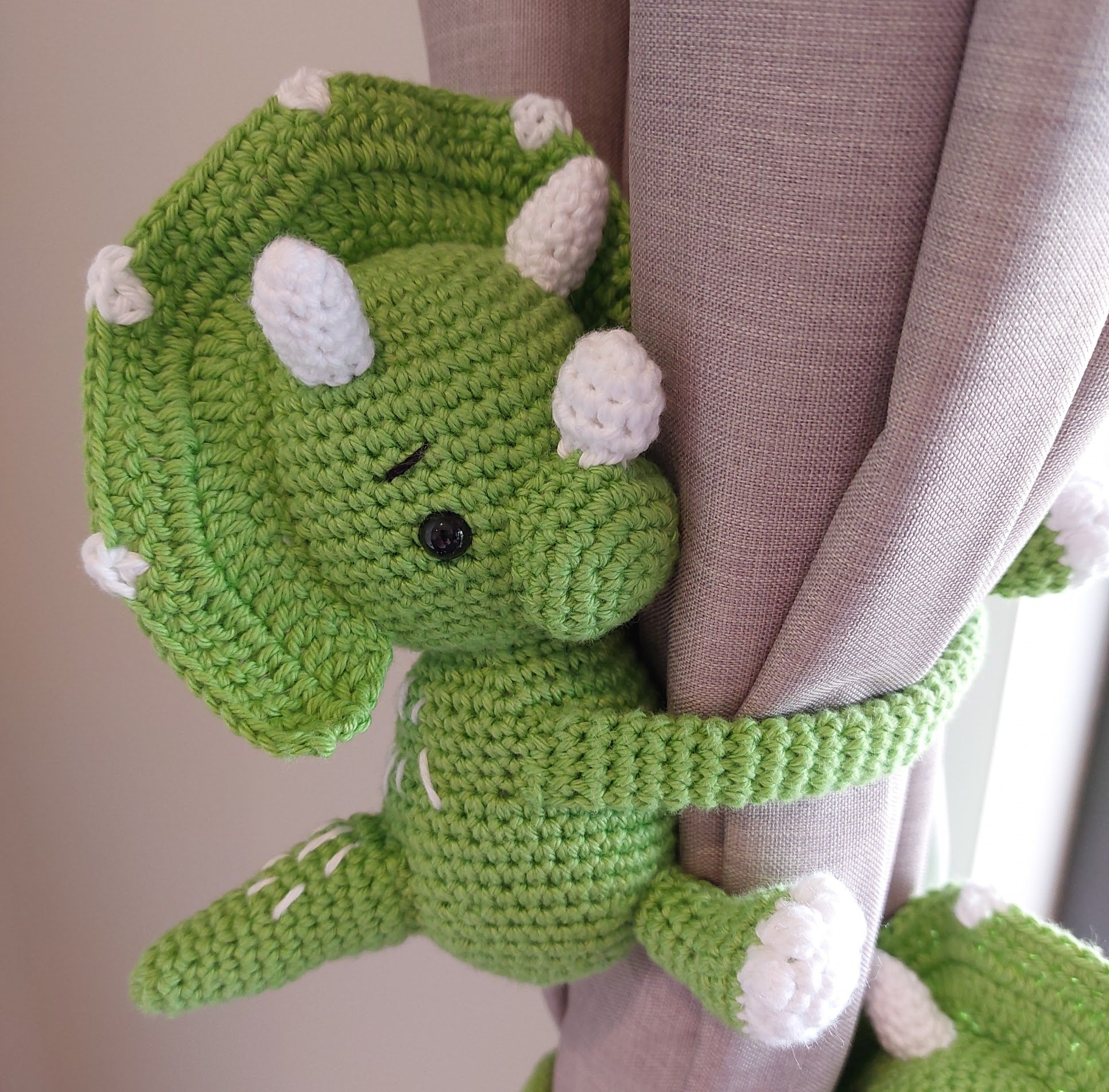 triceratops tie back (right facing) ready to be tied on a curtain, backpack or almost anywhere